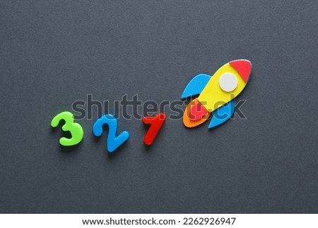 Rocket with a countdown on a gray background