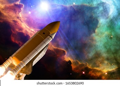 Rocket In The Deep Space. Galaxy And Stars. The Elements Of This Image Furnished By NASA.
