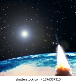 Rocket And The Earth. Stars. Space Concept. The Elements Of This Image Furnished By NASA.

