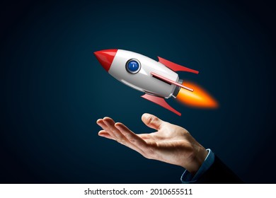 Rocket growth concept. Symbol of fast growth – hand with holding gesture and cartoon rocket flying above hand. - Shutterstock ID 2010655511