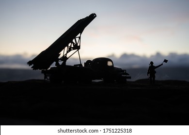 Rocket launch with fire clouds. Battle scene with rocket Missiles with Warhead Aimed at Gloomy Sky at sunset. Soviet rocket launcher on War Background. Creative composition.