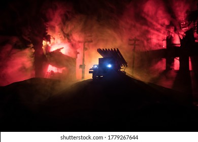 Rocket launch with fire clouds. Battle scene with rocket Missiles with Warhead Aimed at Gloomy Sky at night. Soviet rocket launcher on War Background. Creative composition.