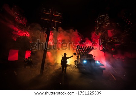 Rocket launch with fire clouds. Battle scene with rocket Missiles with Warhead Aimed at Gloomy Sky at night. Soviet rocket launcher on War Background. Creative composition.