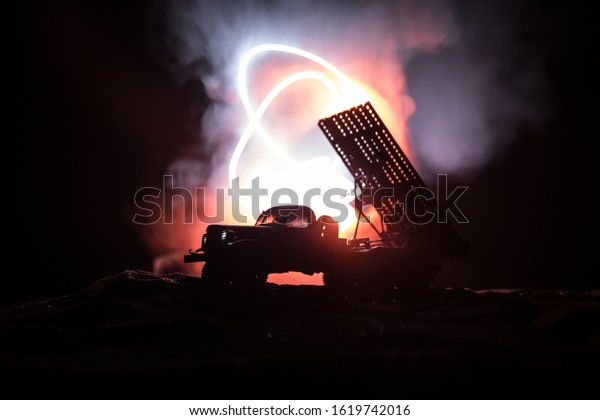 Rocket launch with fire\
clouds. Battle scene with rocket Missiles with Warhead Aimed at\
Gloomy Sky at night. Soviet rocket launcher on War Background.\
Creative composition.