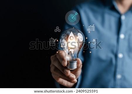 Rocket launch idea inside lightbulb with arrows up. strategically planning and initiating a corporate startup. aim to achieve objectives through value development, fostering leadership.