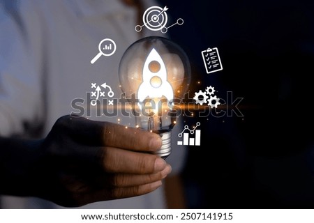 Rocket launch idea inside lightbulb. strategically planning and initiating a corporate startup. aim to achieve objectives through value development, fostering leadership