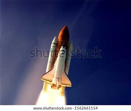 Rocket launch into dramatic sky. The elements of this image furnished by NASA.