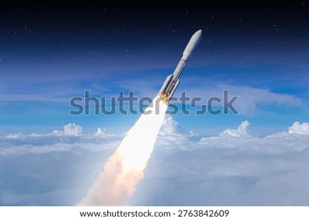 Rocket launch into outer space. Spacecraft liftoff through the clouds into sky. Spaceship launch above the clouds. Elements of this image furnished NASA. 