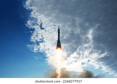 Rocket launch into space. Elements of this image were furnished by NASA. High quality photo - Powered by Shutterstock - Get 15% off with code: PIKWIZARD15