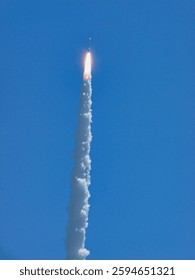 Rocket launch into space. Low angle shot of a plane with traces in a blue sky. Cloud of white smoke from industrial chimney against blue clear sky. Elements of this image furnished by NASA