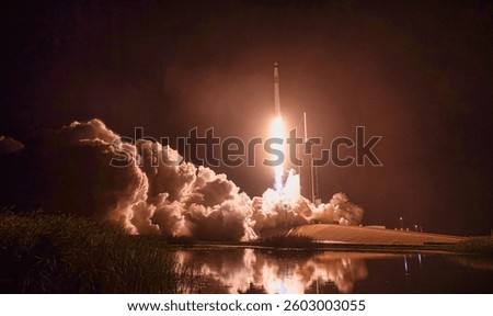 Rocket launch at sunset illuminating the clouds and creating a breathtaking sky. Dramatic rocket launch. A rocket launching with flames and smoke. Elements of this image furnished by NASA