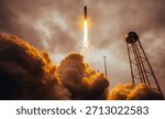 Rocket launching vertically into cloudy sky with massive smoke and water tower Space vehicle lift off with bright engine fire propulsion. Elements of this image furnished by NASA