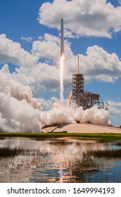 Rocket lifting off into the clouds.  - Shutterstock ID 1649994193