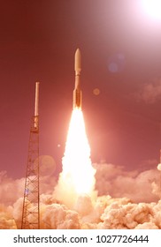 Rocket and light. The elements of this image furnished by NASA.