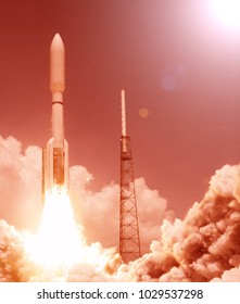 Rocket and light. The elements of this image furnished by NASA.