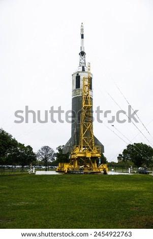 rocket model standing in the rain, johnson space center, houston, texas