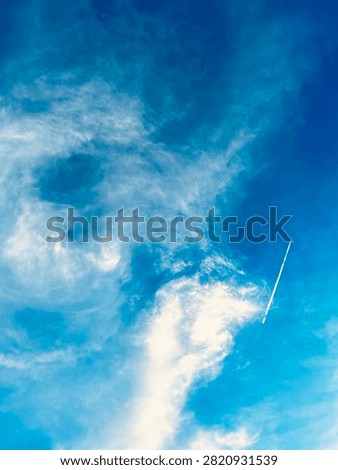Rocket piercing through a dramatic sky … bluesky 