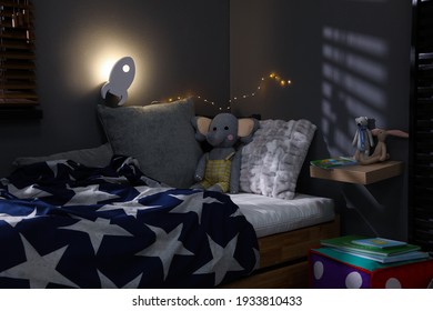 Rocket Shaped Night Lamp On Wall In Child's Room