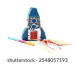 Rocket shaped pinata and stick isolated on white