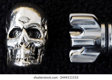 Rocket, skull, bullet. Objects isolated. Bullet, braincase on a black background. Metal objects. Scull, cranium, pericranium. Rocket, pellet, ball, missile. Pirate, rock                               
