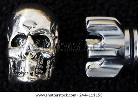 Rocket, skull, bullet. Objects isolated. Bullet, braincase on a black background. Metal objects. Scull, cranium, pericranium. Rocket, pellet, ball, missile. Pirate, rock                               