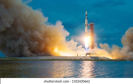Rocket takes off into the sky. Lots of smoke and gas. The elements of this image furnished by NASA. - Shutterstock ID 1332420662
