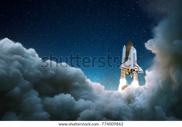 Rocket takes off in the\
starry sky. Spaceship begins the mission. Space shuttle taking off\
on a mission. 