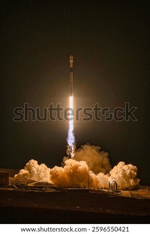 A rocket taking off from a rocket launch. A powerful rocket taking off into the sky, leaving behind a trail of smoke. Dramatic rocket launch. Take off. Elements of this image furnished by NASA