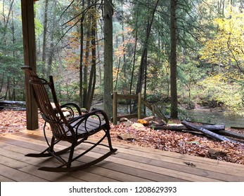 Rocking Chair On Porch Next To River