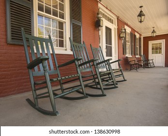 Rocking Chairs On Porch Of Historic New England House In Vermont