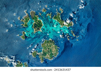 Rocking the Isles of Scilly. Shallow rock formations and sandbars allow people to occasionally walk between the islands. Elements of this image furnished by NASA.