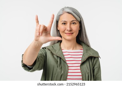 Rock-n-roll Gesture. Caucasian Middle-aged Mature Woman In Casual Clothes Music Rock Fan On A Concert Isolated In White Background