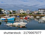 Rockport - A sunny Autumn morning view of colorful fishing boats docking in the peaceful inner harbor of Rockport, a small seaside resort town at tip of Cape Ann, near Boston, Massachusetts, USA.