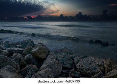 Rocks Along The Galveston Seawall At Dawn