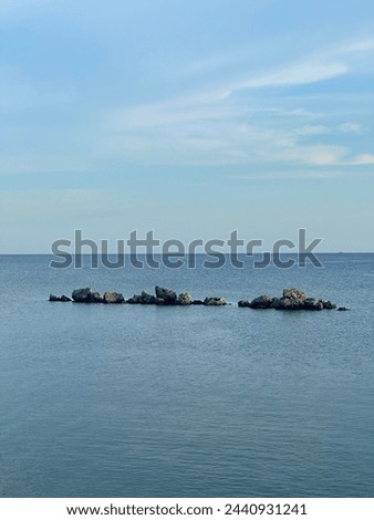 rocks between the vast sea water