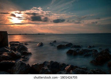 Rocks and clouds at the sunset