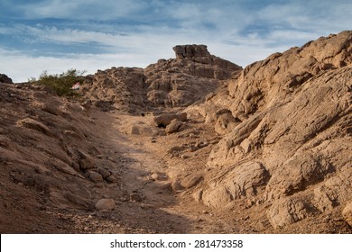 Rocks In The Desert, Egypt Landscape In The Desert In Egypt. Small Rocky Hills. Blue Sky With White Clouds.