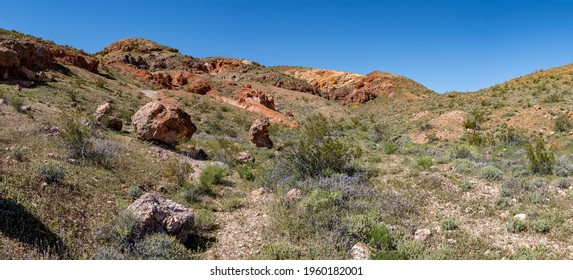 Rocks hills and brush fill the wilderness land in the mojave Desert of Southern California near Ridgecrest.