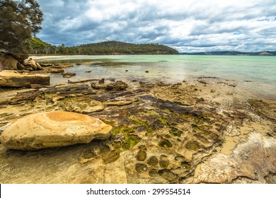 Rocks In Lime Bay Beach Camping Inside The Lime Bay State Reserve, Located At The Northern End Of The Tasman Peninsula To The West Of Whitehouse Point. Tasmania, Australia. .