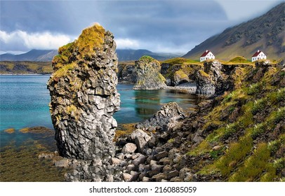 Rocks on the seashore in the mountains. Coastline rocks in mountain sea. Rocks at coastline. Coastline rocks landscape