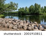 Rocks on the shoreline and in the water of the St. Croix River at St. Croix State Park in Hinckley, Minnesota USA.