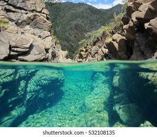 Rocks Over And Underwater Split View In The River Dumbea, New Caledonia