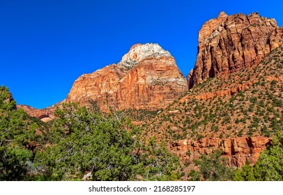 Rocks of the red canyon. Canyon red rocks on blue sky background. Red rock canyon scene. Red rocks in canyon desert - Shutterstock ID 2168285197