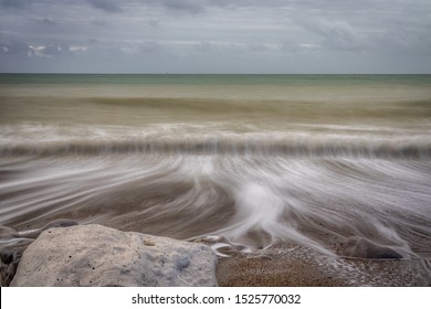 Rocks In Retreating Waves With Undertow