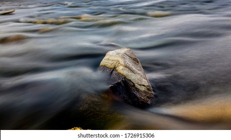 Rocks in a River Long Exposure - Shutterstock ID 1726915306