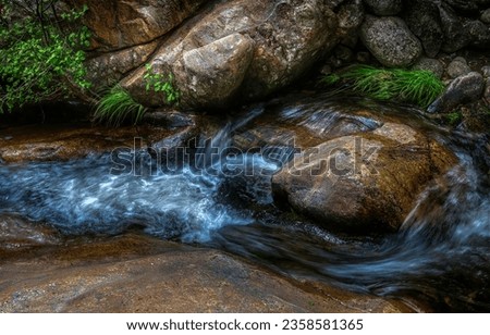 Rocks in the river stream. River rocks. River water on rocks. Forest stream rocks