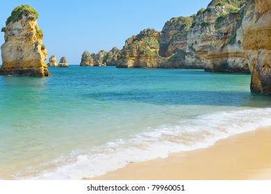 Rocks And Sandy Beach In Portugal, Lagos
