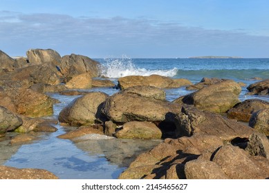  Rocks In The Sea And Wave Background On A Brittany Beach -France