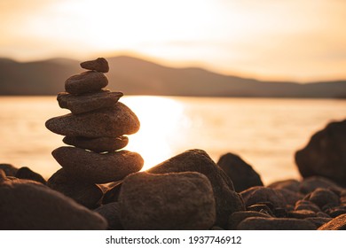 Rocks Standing At Orange Sunset