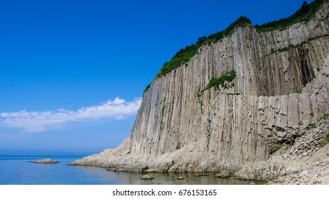 Rocks of Stolbchaty cape in Kunashir, kuril islands, Russia - Shutterstock ID 676153165